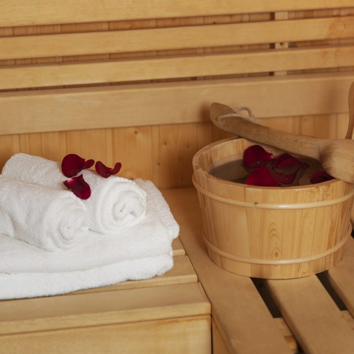 Sauna bucket with rose petals